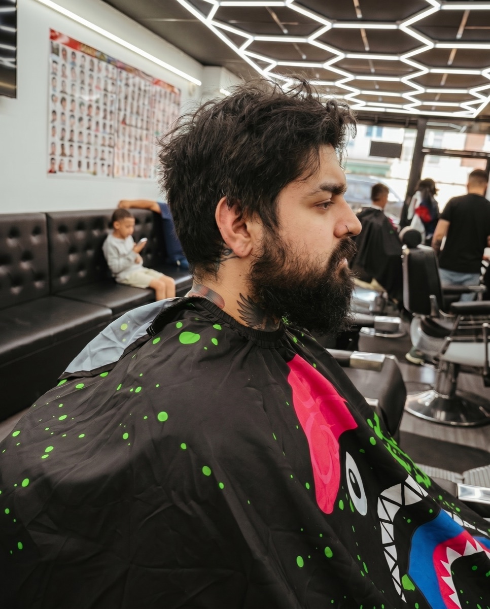 Same client with grown-out hair and beard before the cut